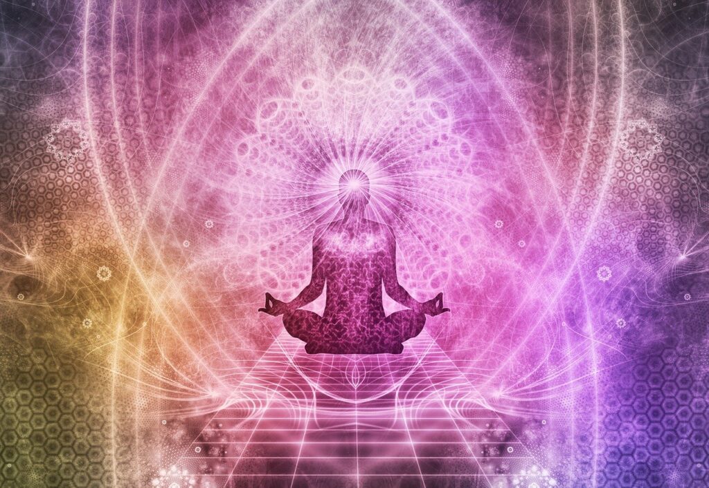 Computer-processed image of a person meditating surrounded by cosmic lights.