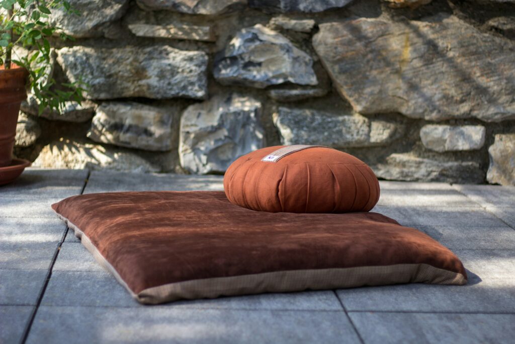 Red zabuton meditation mat with matching red zafu