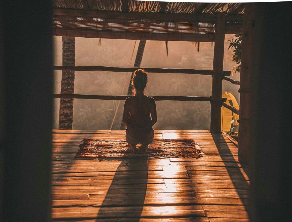 Person meditating in seiza position.